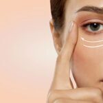 beautiful young woman face with arrows under eye